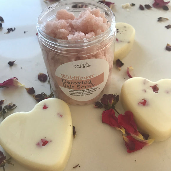 Emulsified detoxing salt scrub and luxurious moisturizing solid lotion bars with dried rose buds and wild rose fragrance